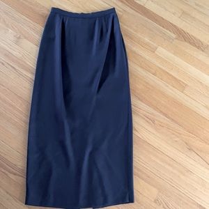 Elegant Black maxi skirt. Slit, elastic rear waist